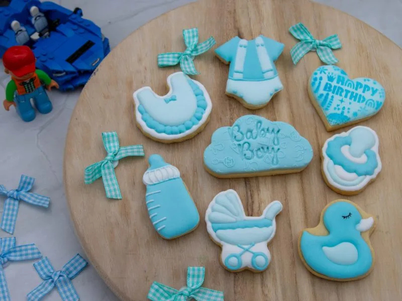 Baby boy cookie set styled with baby-themed props