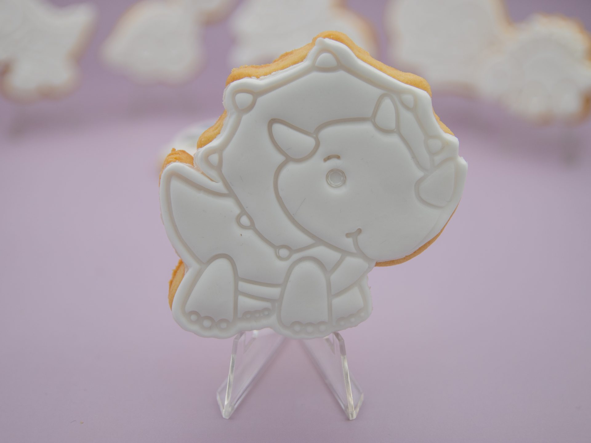 triceratops dinosaur cookie decorated with fondant for painting