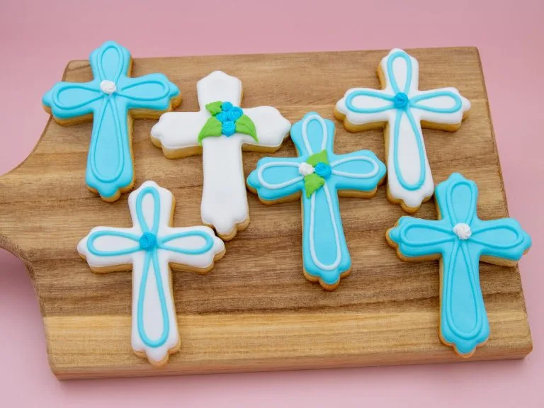 Boys’ communion cookies styled with props for baptism