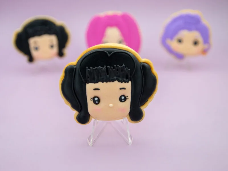 Black hair Zoey Huntrix character cookie with royal icing