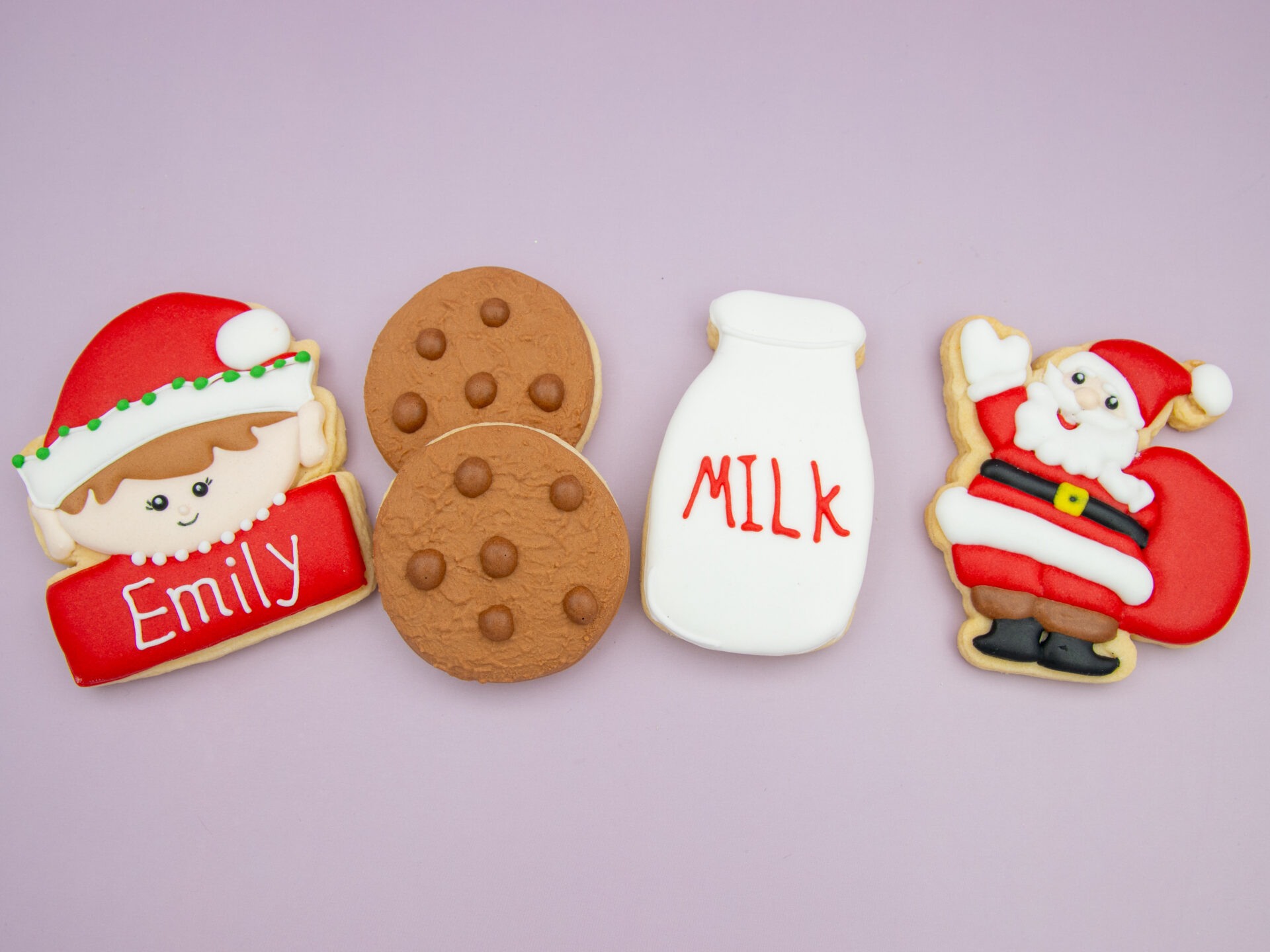Santa’s Night Snack Cookies flat lay with elf, cookies, milk bottle and Santa