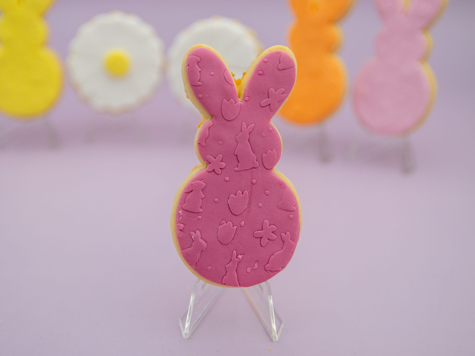 Dark pink bunny fondant Easter cookie with embossed Easter details