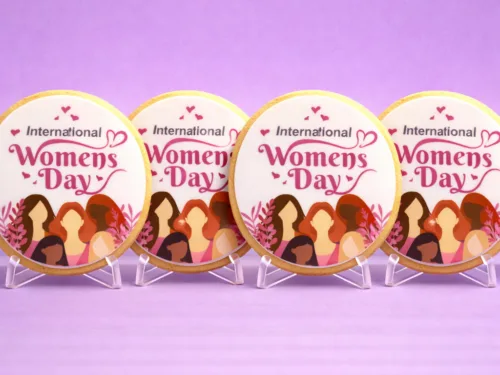 International Women’s Day Corporate Cookies standing side by side with pink edible print design