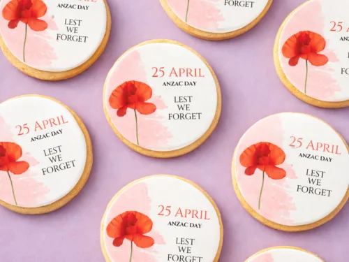 ANZAC Day Tribute Cookies flat lay showing printed poppy and Lest We Forget design