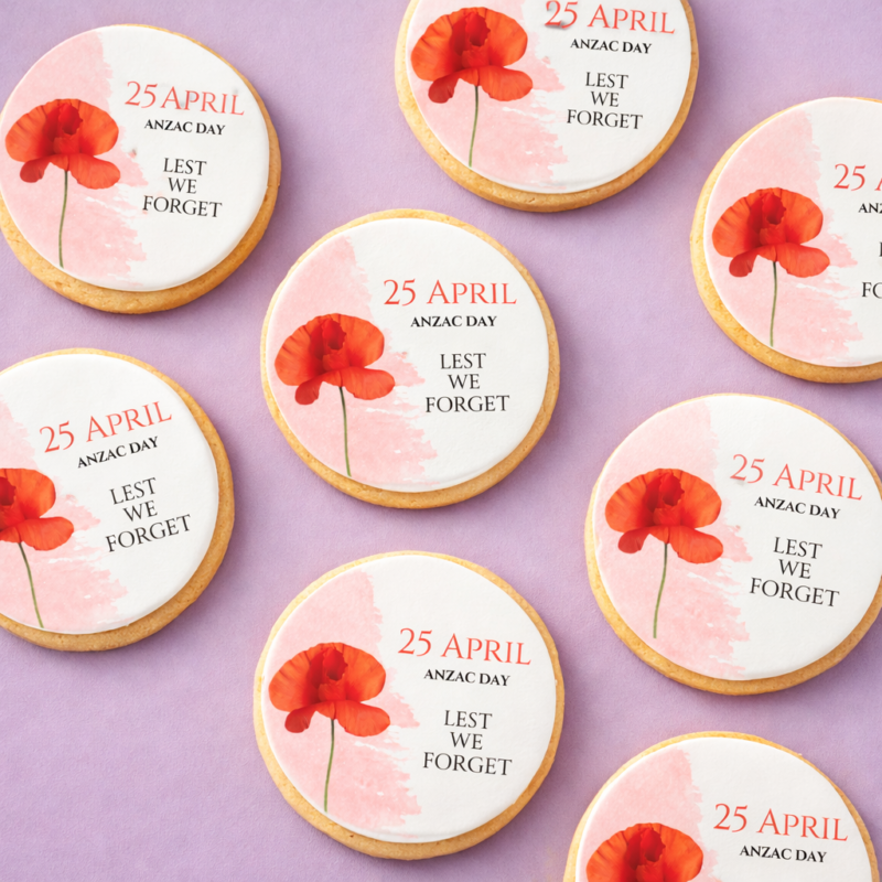 ANZAC Day Tribute Cookies flat lay showing printed poppy and Lest We Forget design