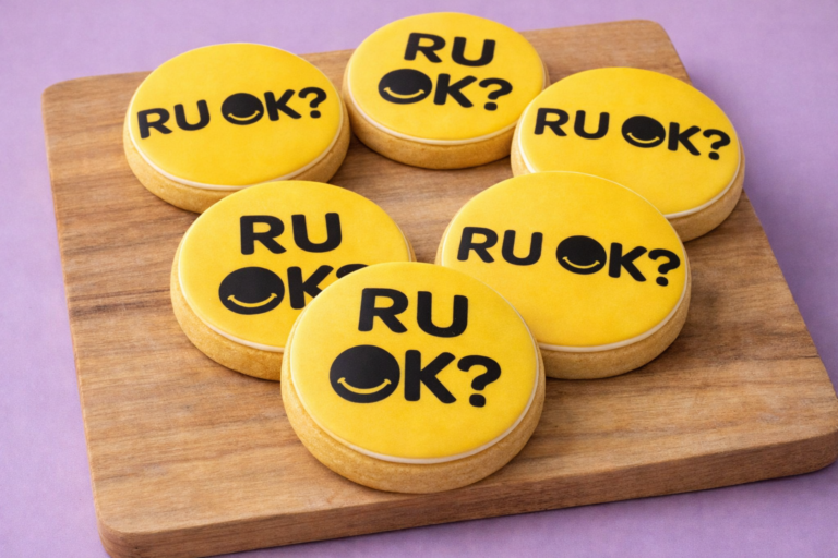 R U OK? Awareness Cookies styled in a bright yellow edible print fondant set for workplace wellbeing events
