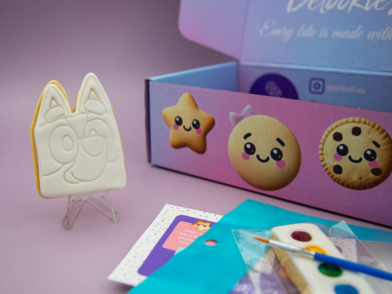 Bluey DIY cookie favour standing upright with edible painting kit for birthday party bags