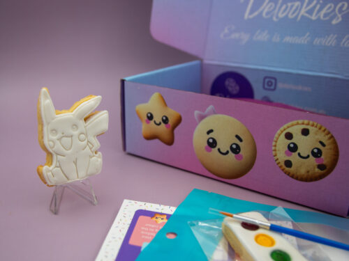 Pikachu DIY cookie favour standing upright for Pokemon themed birthday party activity
