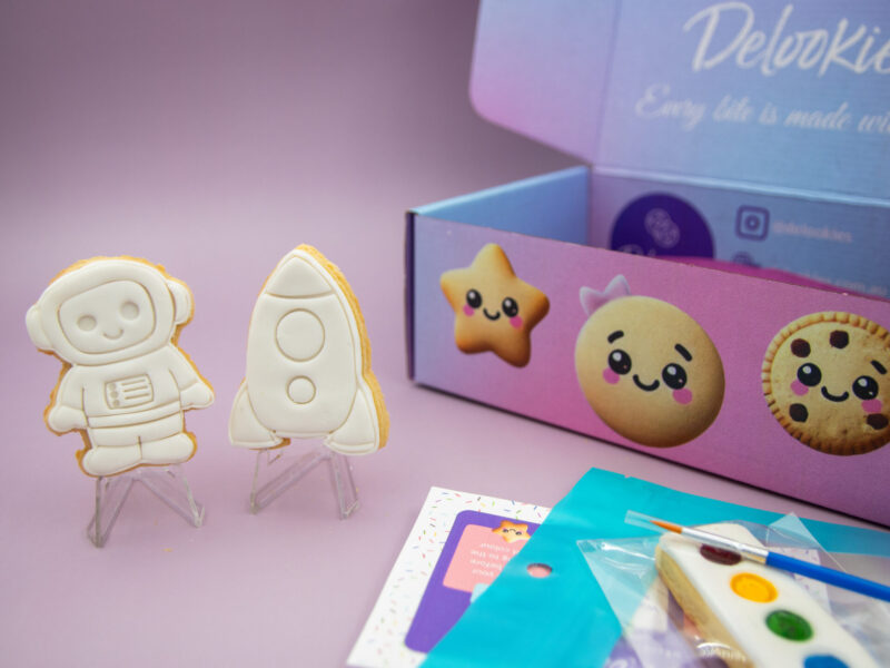 astronaut and rocket DIY cookie favour standing upright for kids space party activity