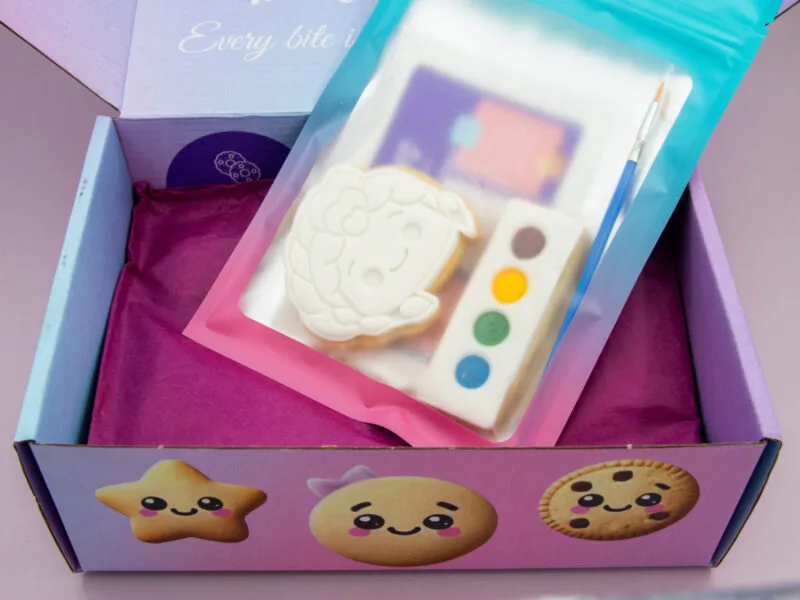 Rumi Kpop Huntrix DIY cookie favour packed with palette, brush and guide card in heat sealed wrapper