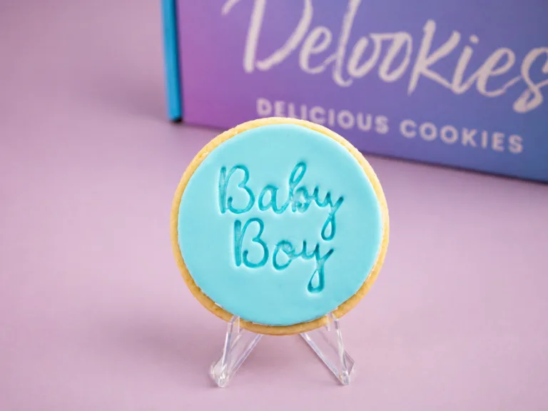Close up baby boy cookie with embossed Baby Boy message on fondant