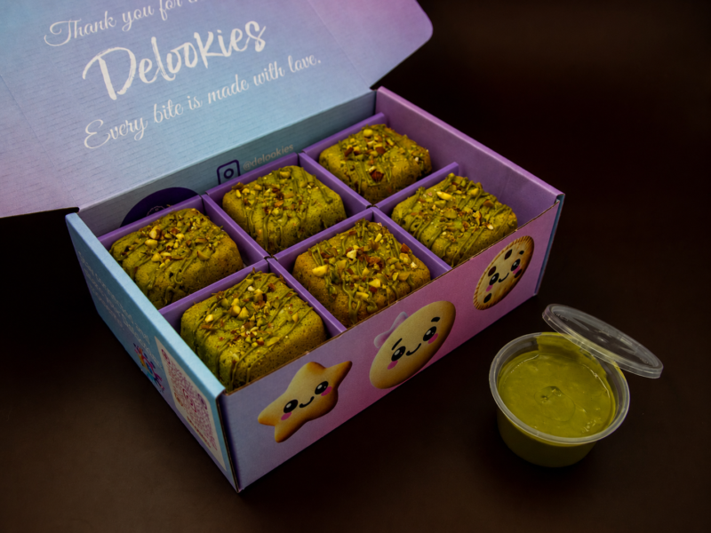 Pistachio Cream Cookie Cubes packed inside Delookies dessert box with pistachio dip