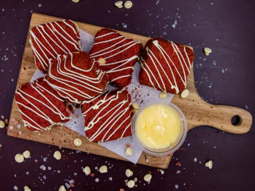 Soft-baked Red Velvet Cream Cookie Cubes on wooden serving board