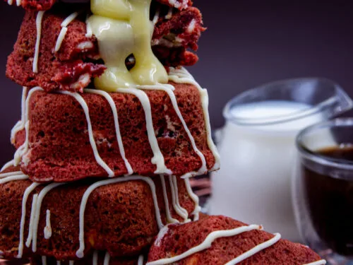 Stacked Red Velvet Cream Cookie Cubes with melted white chocolate filling