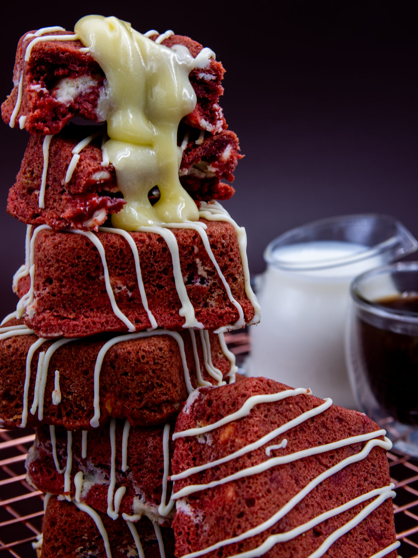 Stacked Red Velvet Cream Cookie Cubes with melted white chocolate filling