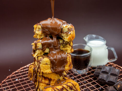 Chocolate Chip Cookie Cubes with chocolate drizzle served with coffee and milk