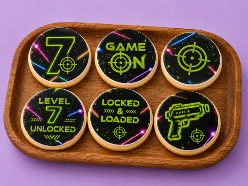 Level 7 Laser Tag Cookies styled for a kids birthday party with neon edible printed fondant designs